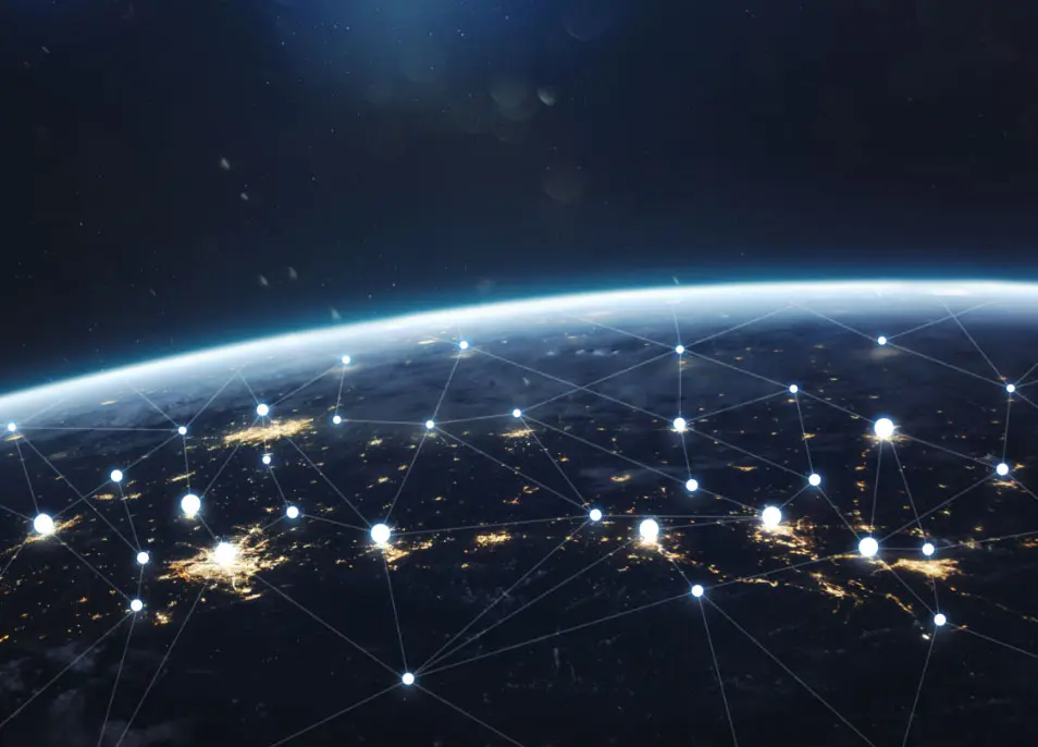 Network of connected lights across the globe at night